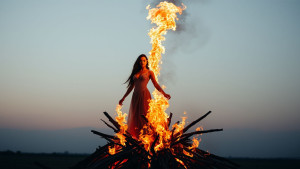beautiful-woman-engulfed-in-liquid-flame-stands-on-a-burning-pyre.jpg