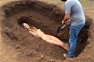fufilling_her_fantasy_of_being_buried_alive_.jpg
