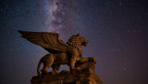 Winged lion with human head in ancient Iraq under starry night sky - L1.jpg