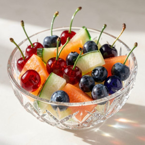 An entire fruit salad meticulously crafted from clear and colored glass.jpg