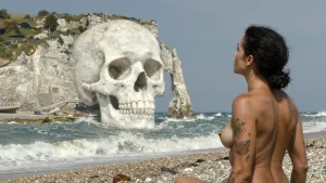 lydia-the-tattooed-woman-a-muscular-tattooed-woman-bare-chested-from-the-beach-she-looks-in-amazemen.webp