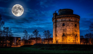 Giant Flak tower in wartime Berlin under full moon - S.jpg